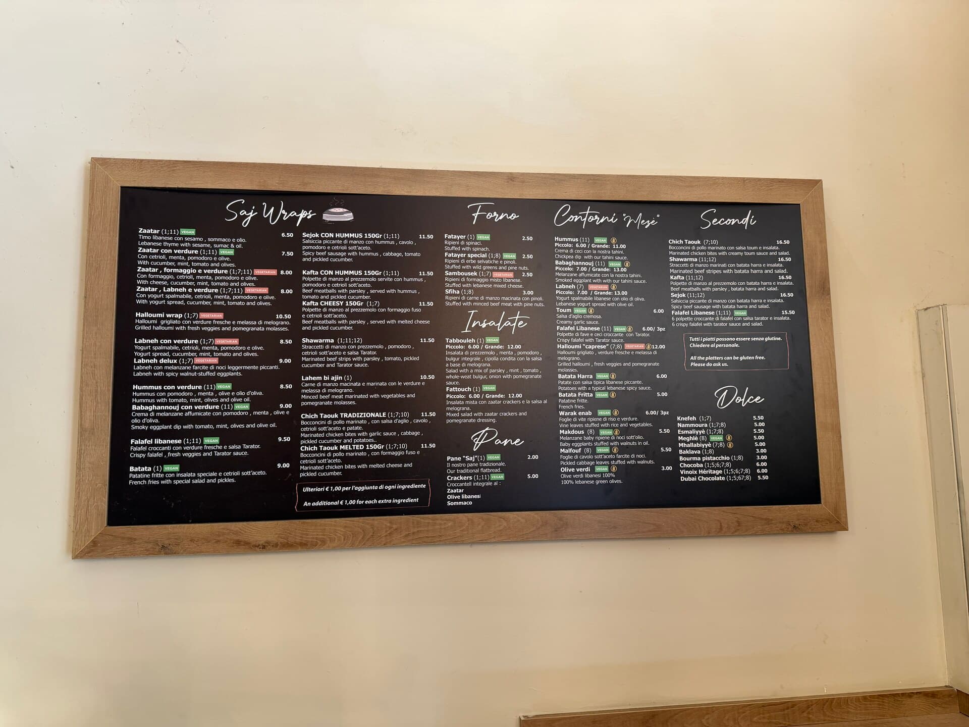 Lo Saj menu board with saj wraps, salads and mezze prices