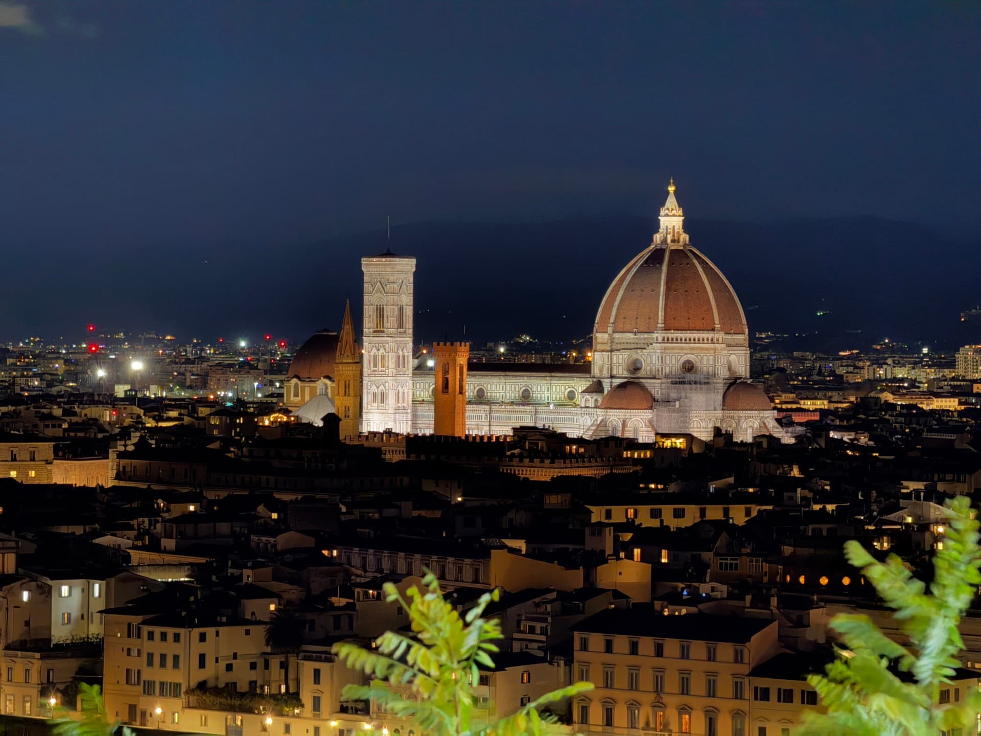 Florence's rooftops and the floodlit Duomo seen from Piazzale Michelangelo at night