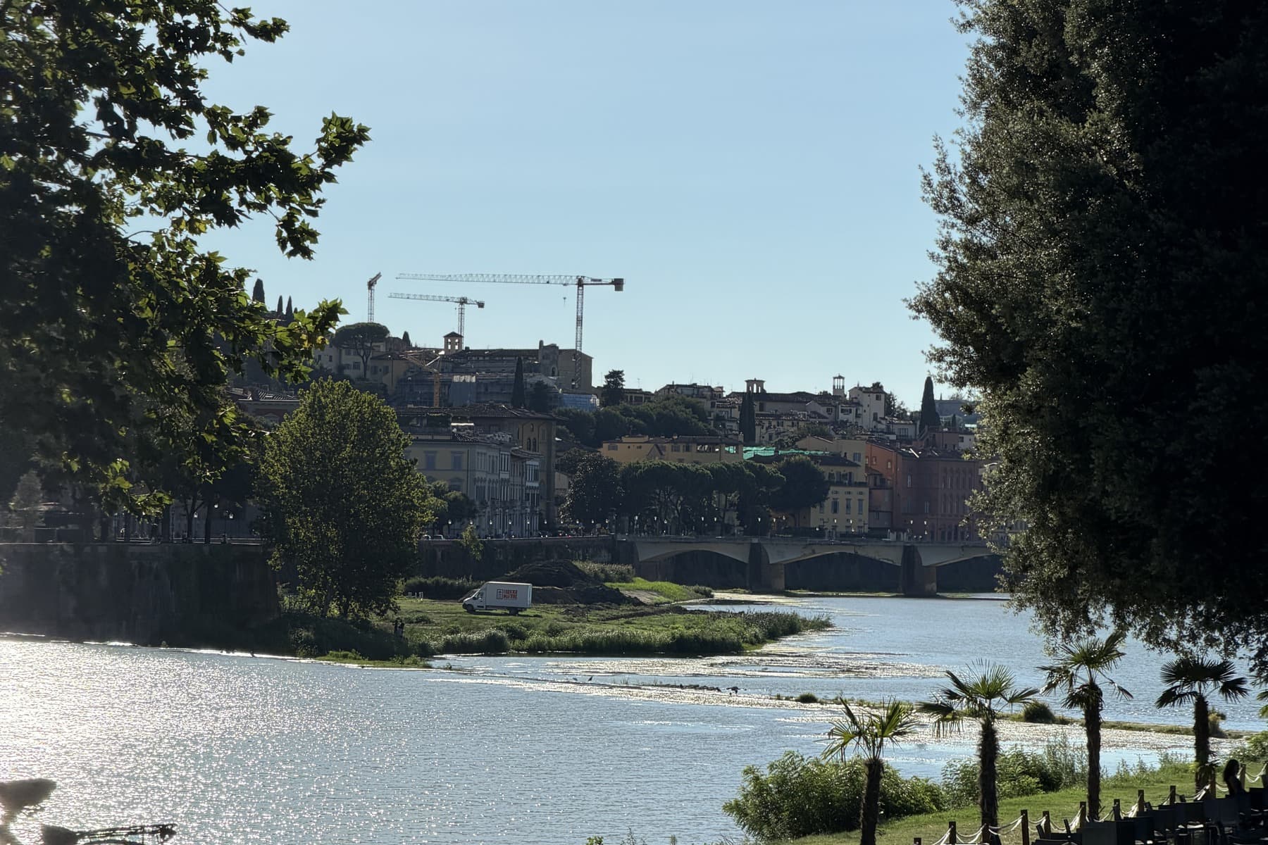 The Arno seen from the park, with the Florence skyline and a bridge beyond