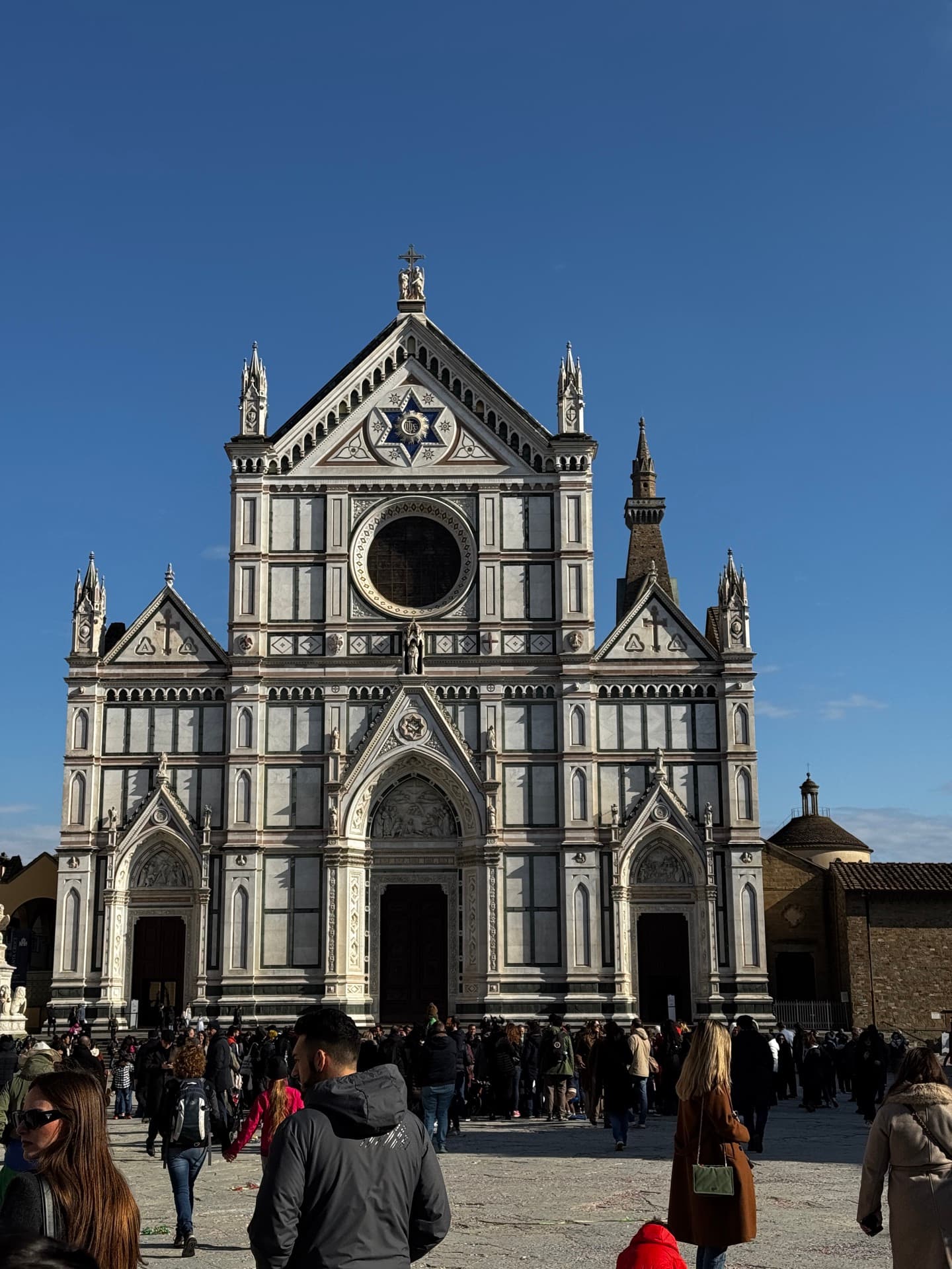 The marble façade of the Basilica di Santa Croce rising above its wide piazza